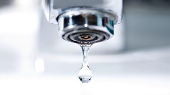 faucet with a water dripping down